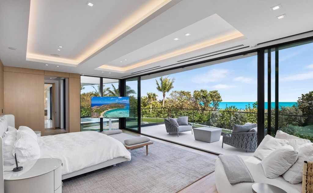 This exceptional oceanfront estate on Jupiter Island, crafted by DOMO Architecture and Design, offers 6 bedrooms, 8 baths, and 10,545 square feet of living space on 3.41 acres with 179 feet of ocean frontage.