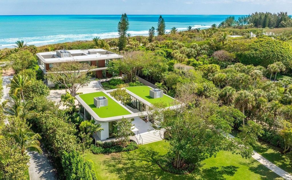 This exceptional oceanfront estate on Jupiter Island, crafted by DOMO Architecture and Design, offers 6 bedrooms, 8 baths, and 10,545 square feet of living space on 3.41 acres with 179 feet of ocean frontage.