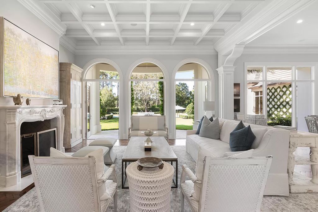 Set on a 1.09-acre lot, this 5-bedroom, 8,589-sf home in the sought-after Old Palm Golf Club combines timeless European design with modern upgrades.