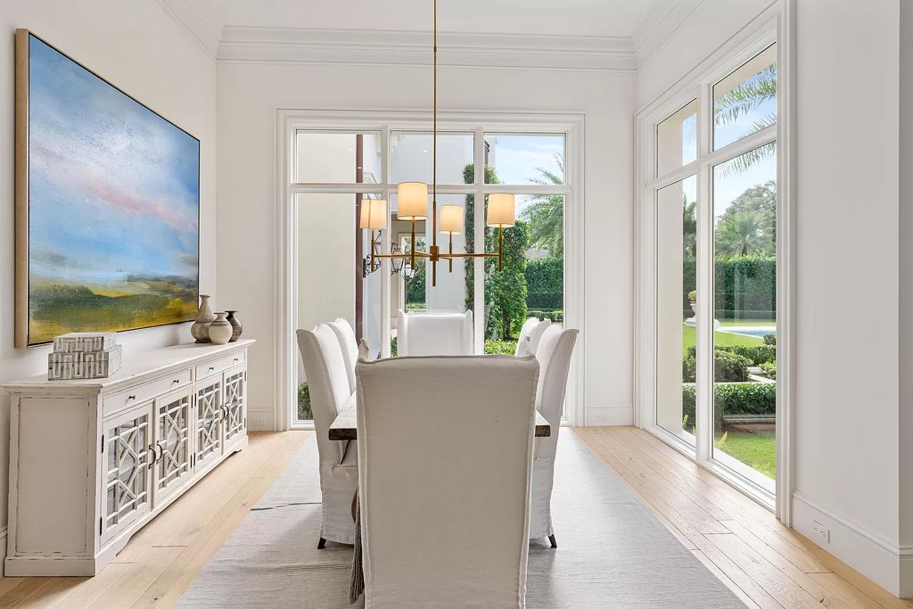 Set on a 1.09-acre lot, this 5-bedroom, 8,589-sf home in the sought-after Old Palm Golf Club combines timeless European design with modern upgrades.