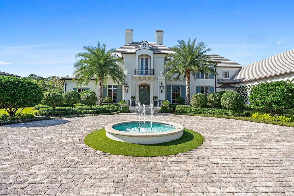 Set on a 1.09-acre lot, this 5-bedroom, 8,589-sf home in the sought-after Old Palm Golf Club combines timeless European design with modern upgrades.