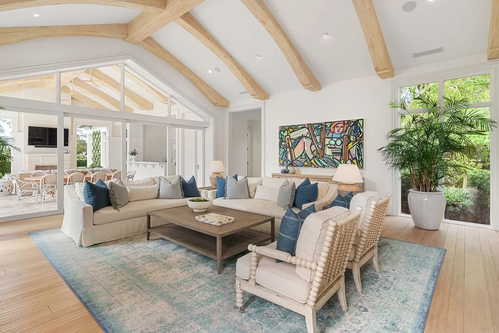 Set on a 1.09-acre lot, this 5-bedroom, 8,589-sf home in the sought-after Old Palm Golf Club combines timeless European design with modern upgrades.