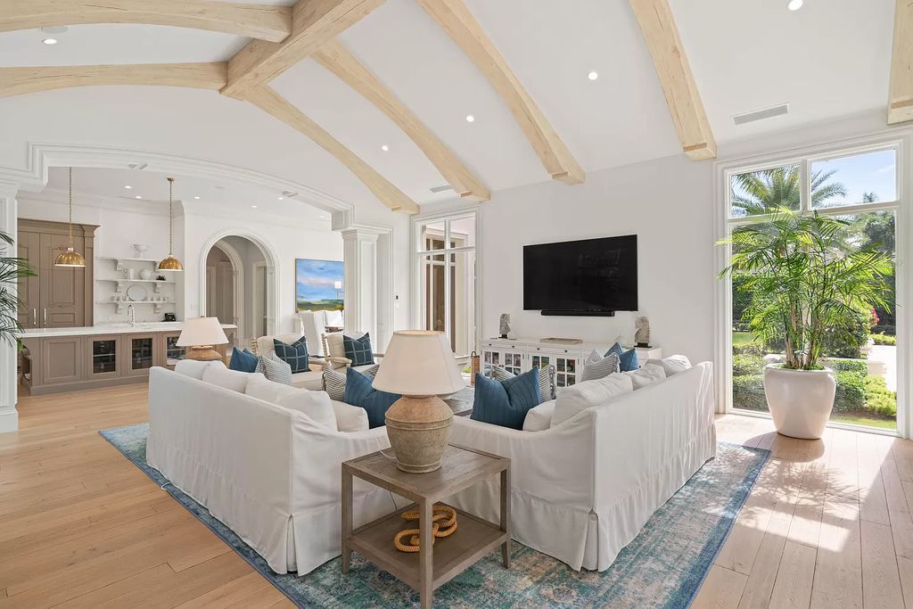 Set on a 1.09-acre lot, this 5-bedroom, 8,589-sf home in the sought-after Old Palm Golf Club combines timeless European design with modern upgrades.