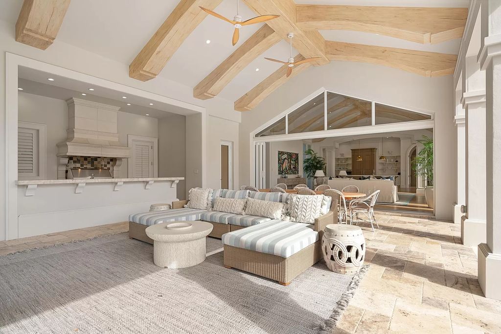 Set on a 1.09-acre lot, this 5-bedroom, 8,589-sf home in the sought-after Old Palm Golf Club combines timeless European design with modern upgrades.