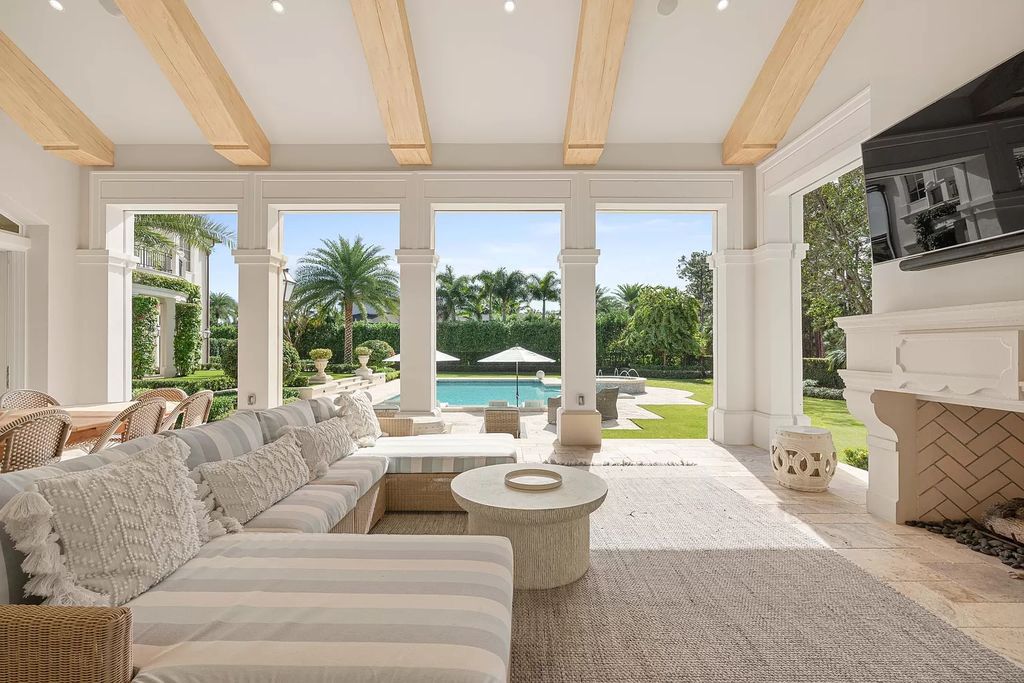 Set on a 1.09-acre lot, this 5-bedroom, 8,589-sf home in the sought-after Old Palm Golf Club combines timeless European design with modern upgrades.