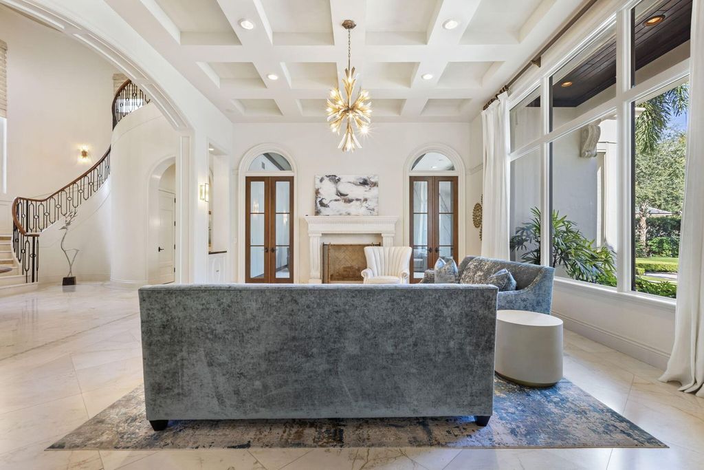 Crafted by renowned builder Lavelle Construction in 2010, this timeless estate spans nearly 10,000 square feet of luxurious living space and is set on a generous 1.1-acre lot, overlooking the 15th fairway.