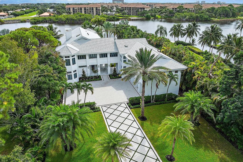 Featuring 8 bedrooms, 13 baths, and 9,306 square feet of space, this 1.55-acre property is ideal for boating enthusiasts.