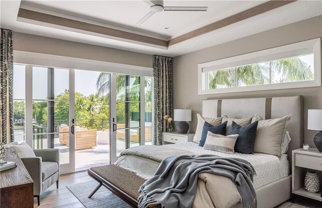 This stunning coastal masterpiece in Aqualane Shores, built in 2021, offers an unparalleled waterfront lifestyle with sweeping views of Jamaica Cove.