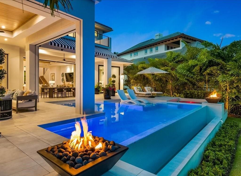 This stunning coastal masterpiece in Aqualane Shores, built in 2021, offers an unparalleled waterfront lifestyle with sweeping views of Jamaica Cove.