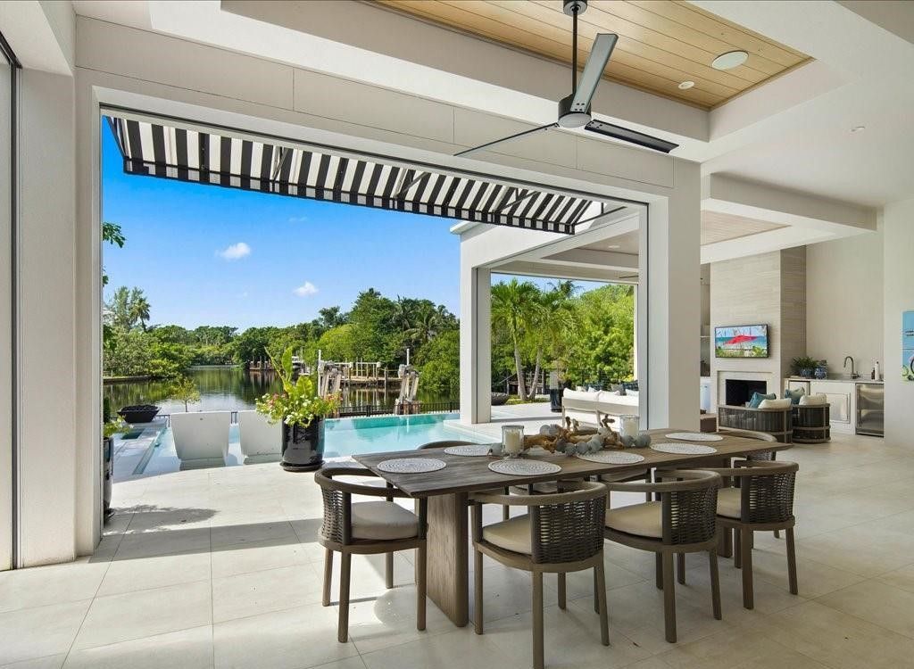 This stunning coastal masterpiece in Aqualane Shores, built in 2021, offers an unparalleled waterfront lifestyle with sweeping views of Jamaica Cove.