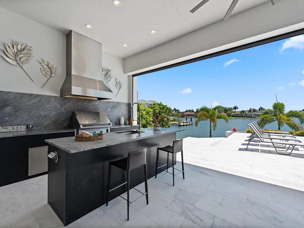 $13.9 Million Spectacular Custom-Built Home with Expansive Outdoor Living and Breathtaking Bay Views in Marco Island