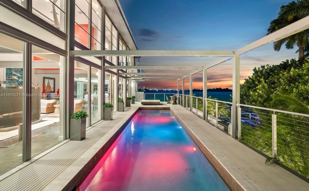 $14.8 Million Modern Glass Masterpiece with Bay Views and Suspended Pool on Belle Meade Island, Miami