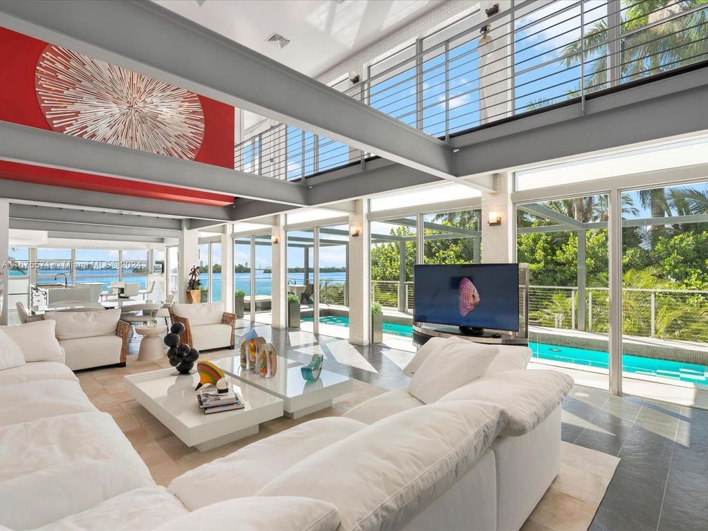 $14.8 Million Modern Glass Masterpiece with Bay Views and Suspended Pool on Belle Meade Island, Miami