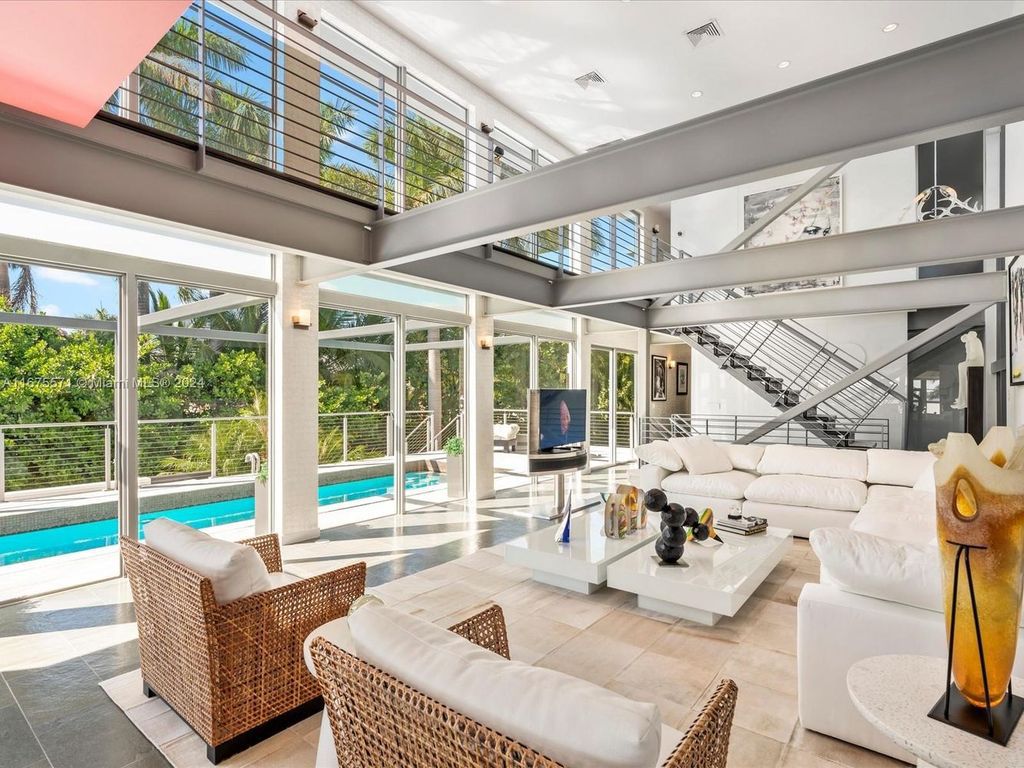 $14.8 Million Modern Glass Masterpiece with Bay Views and Suspended Pool on Belle Meade Island, Miami