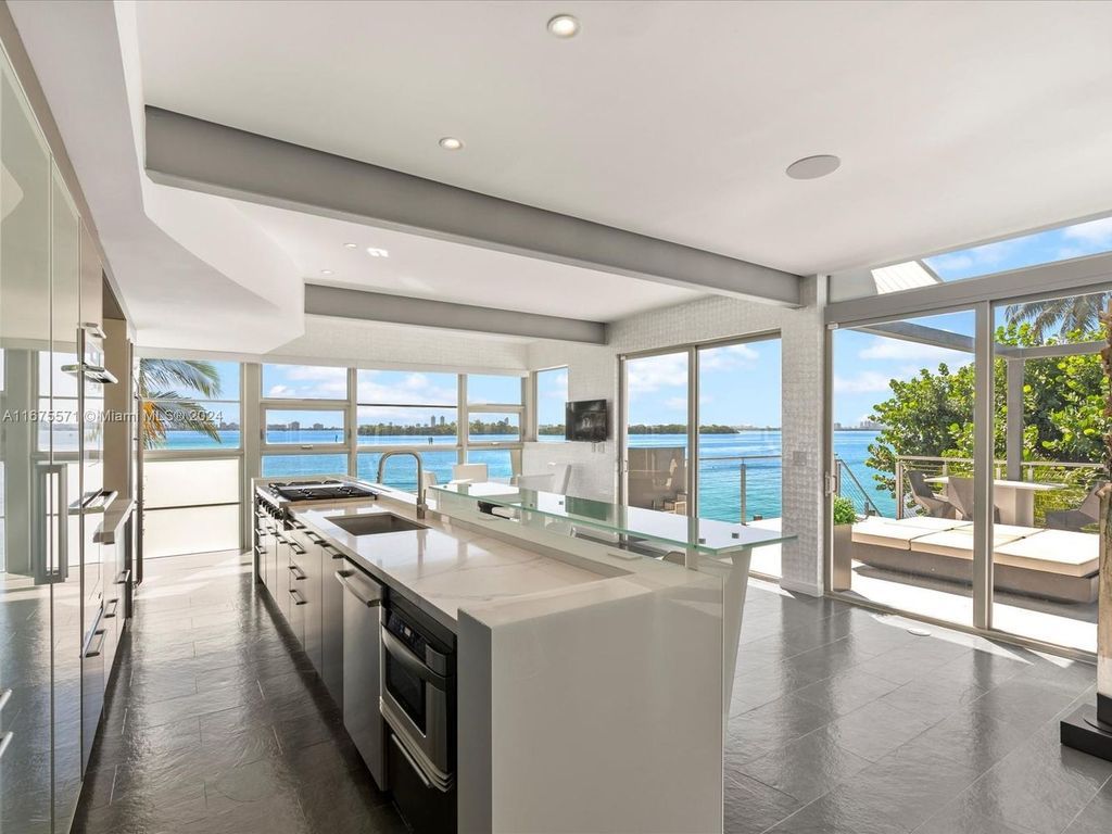 $14.8 Million Modern Glass Masterpiece with Bay Views and Suspended Pool on Belle Meade Island, Miami