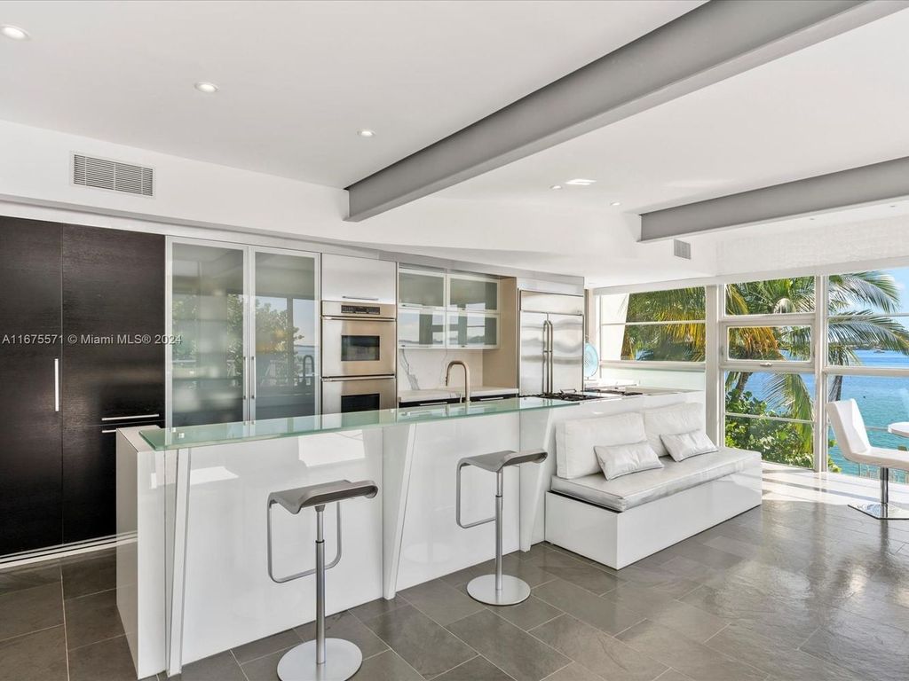 $14.8 Million Modern Glass Masterpiece with Bay Views and Suspended Pool on Belle Meade Island, Miami