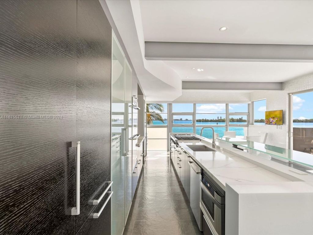 $14.8 Million Modern Glass Masterpiece with Bay Views and Suspended Pool on Belle Meade Island, Miami