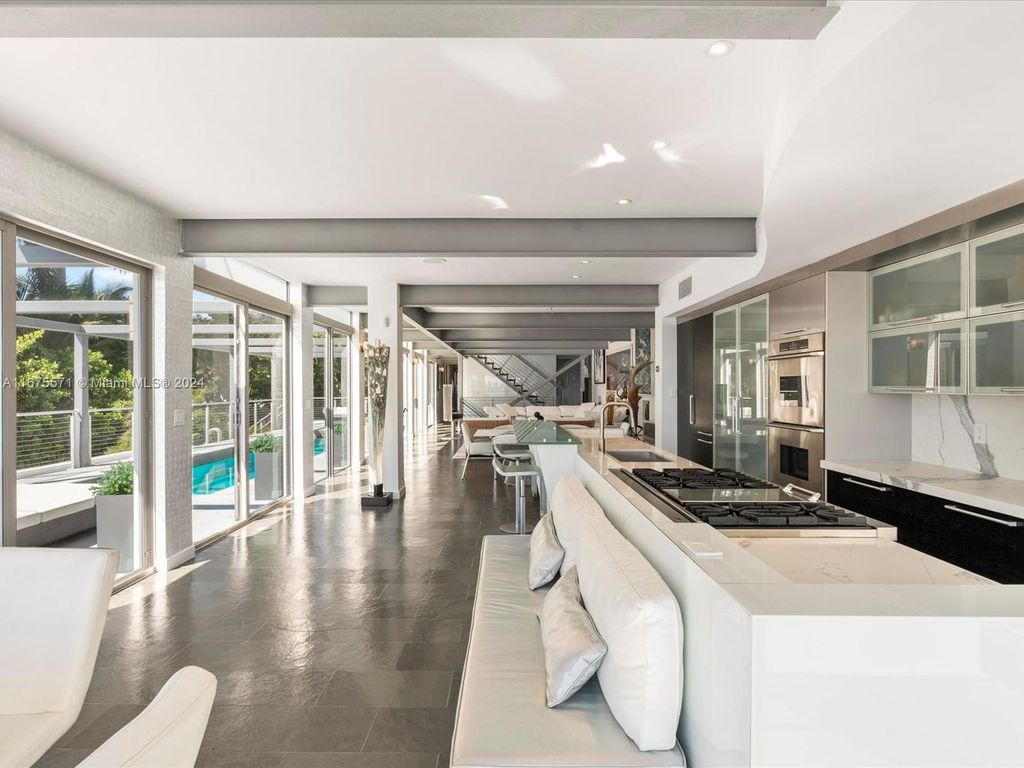 $14.8 Million Modern Glass Masterpiece with Bay Views and Suspended Pool on Belle Meade Island, Miami