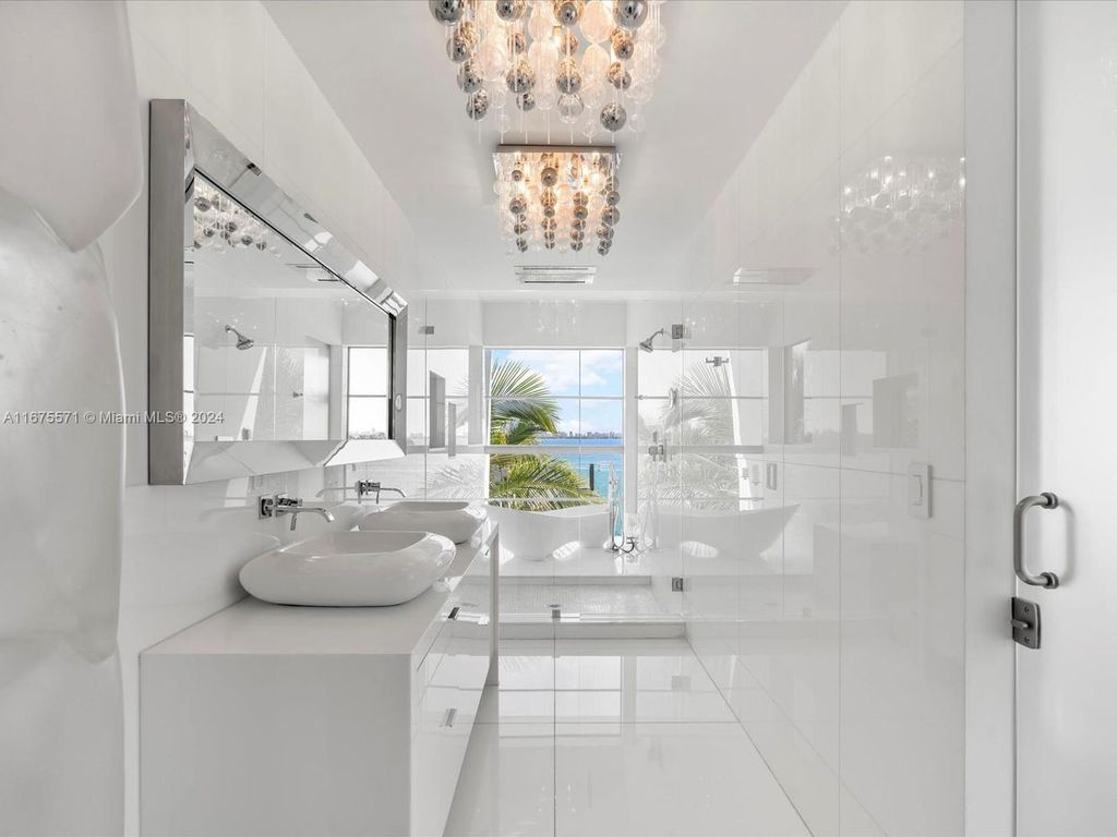 $14.8 Million Modern Glass Masterpiece with Bay Views and Suspended Pool on Belle Meade Island, Miami