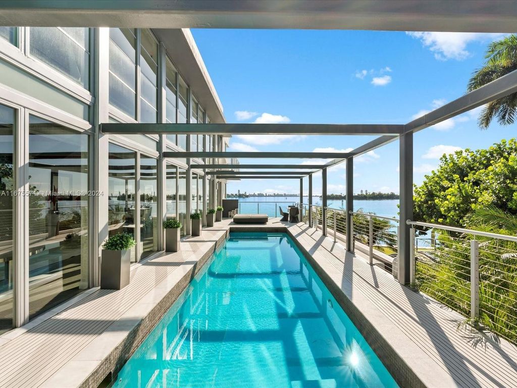 $14.8 Million Modern Glass Masterpiece with Bay Views and Suspended Pool on Belle Meade Island, Miami