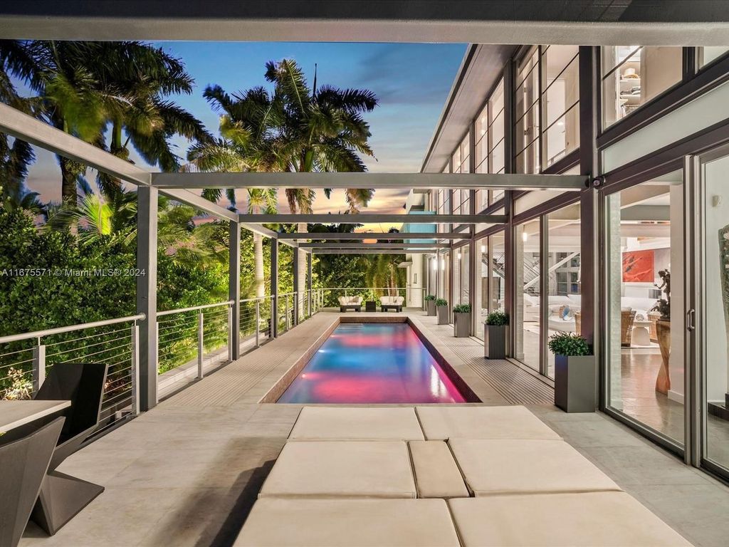 $14.8 Million Modern Glass Masterpiece with Bay Views and Suspended Pool on Belle Meade Island, Miami