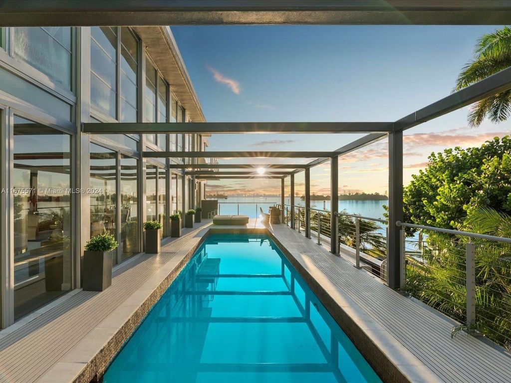 $14.8 Million Modern Glass Masterpiece with Bay Views and Suspended Pool on Belle Meade Island, Miami