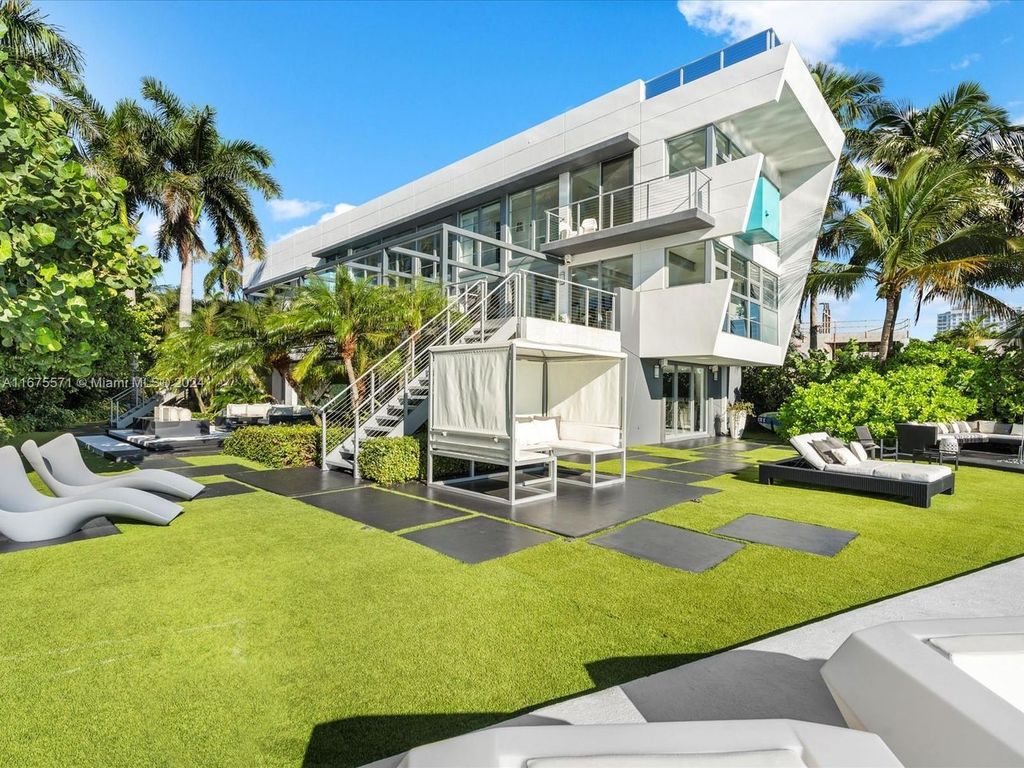 $14.8 Million Modern Glass Masterpiece with Bay Views and Suspended Pool on Belle Meade Island, Miami