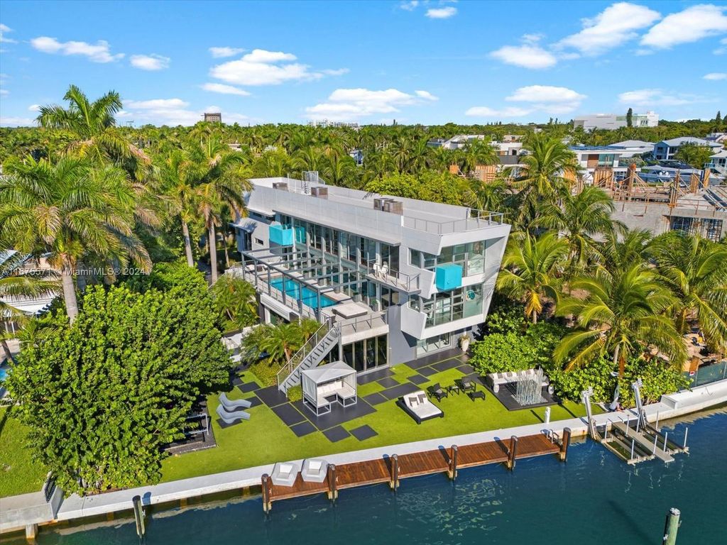 $14.8 Million Modern Glass Masterpiece with Bay Views and Suspended Pool on Belle Meade Island, Miami