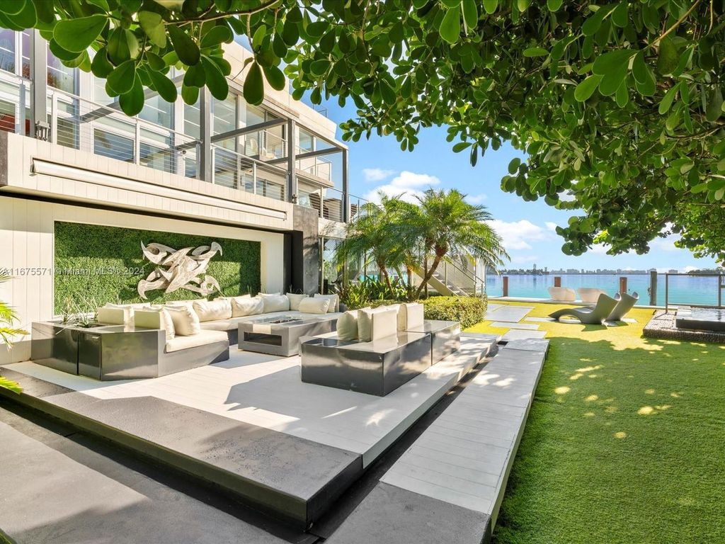 $14.8 Million Modern Glass Masterpiece with Bay Views and Suspended Pool on Belle Meade Island, Miami