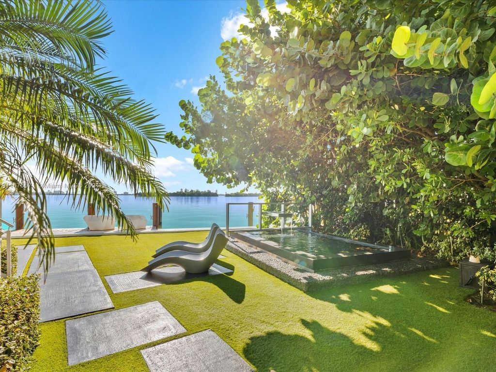 $14.8 Million Modern Glass Masterpiece with Bay Views and Suspended Pool on Belle Meade Island, Miami