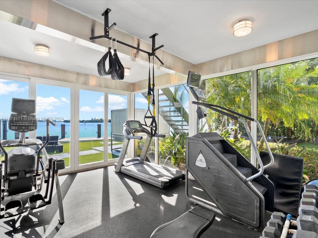 $14.8 Million Modern Glass Masterpiece with Bay Views and Suspended Pool on Belle Meade Island, Miami