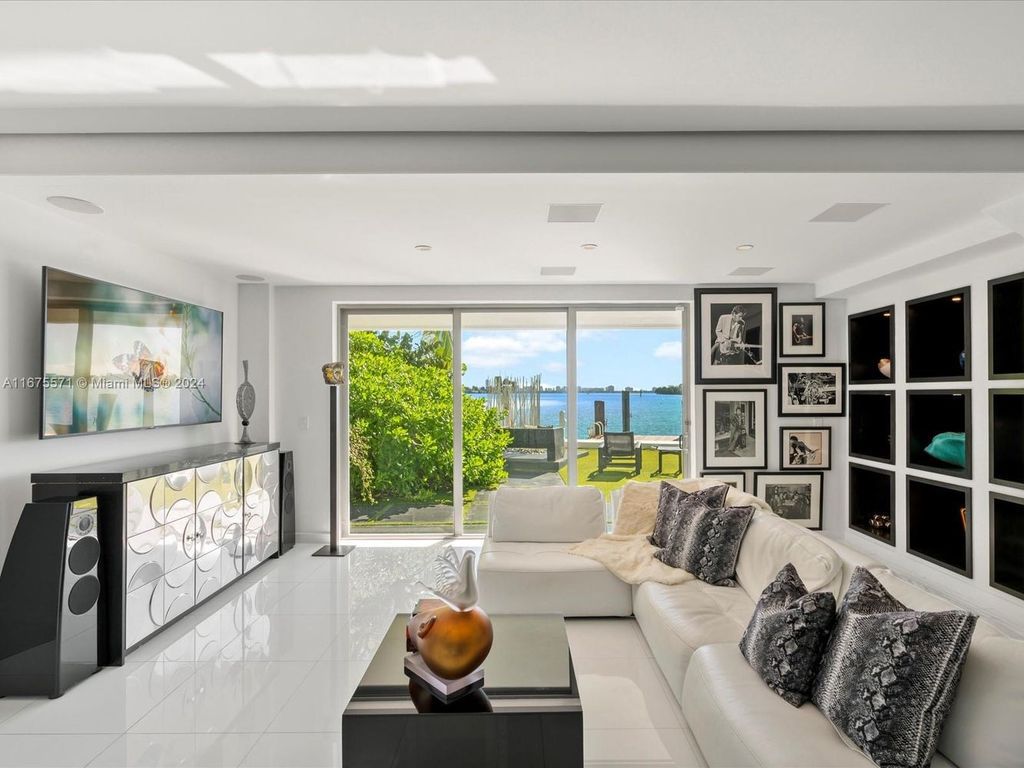 $14.8 Million Modern Glass Masterpiece with Bay Views and Suspended Pool on Belle Meade Island, Miami