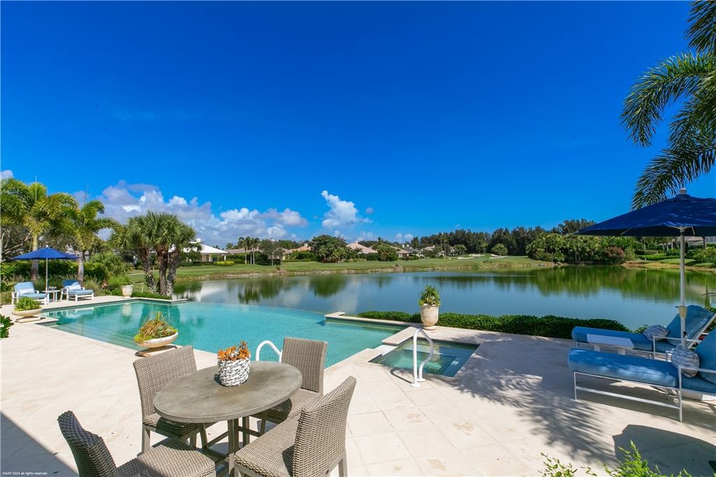 $4.7 Million Lakefront Estate in Orchid Island with Infinity Pool and Golf Course Views