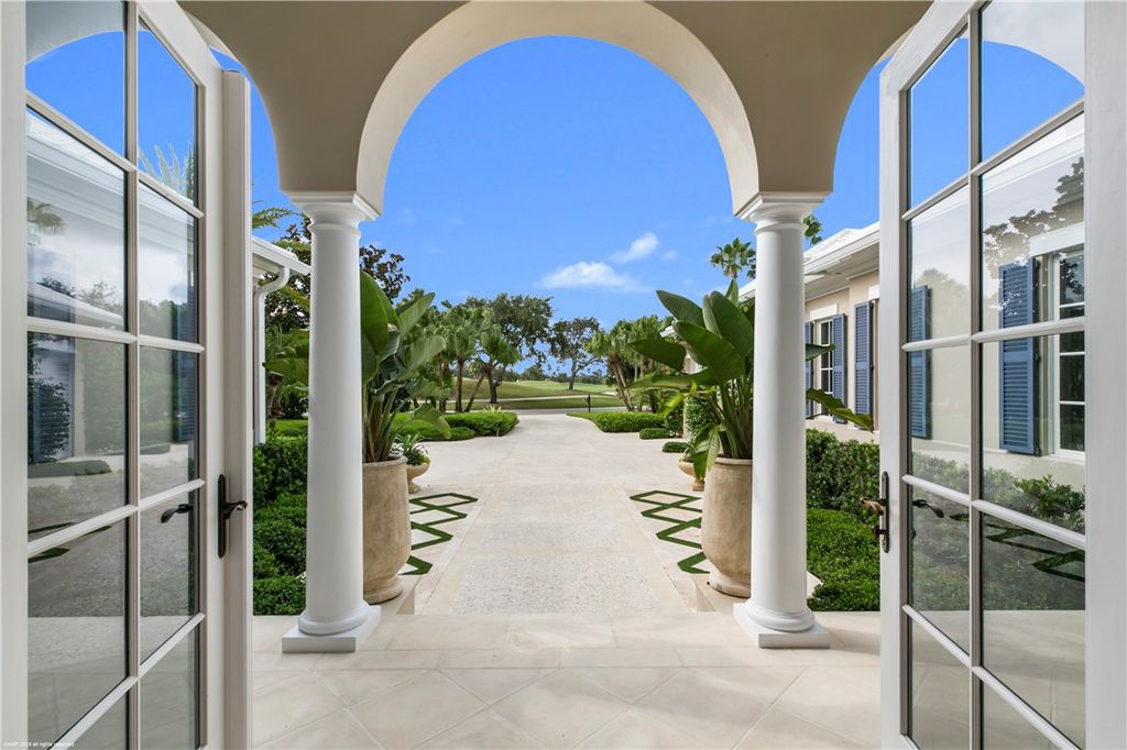 $4.7 Million Lakefront Estate in Orchid Island with Infinity Pool and Golf Course Views