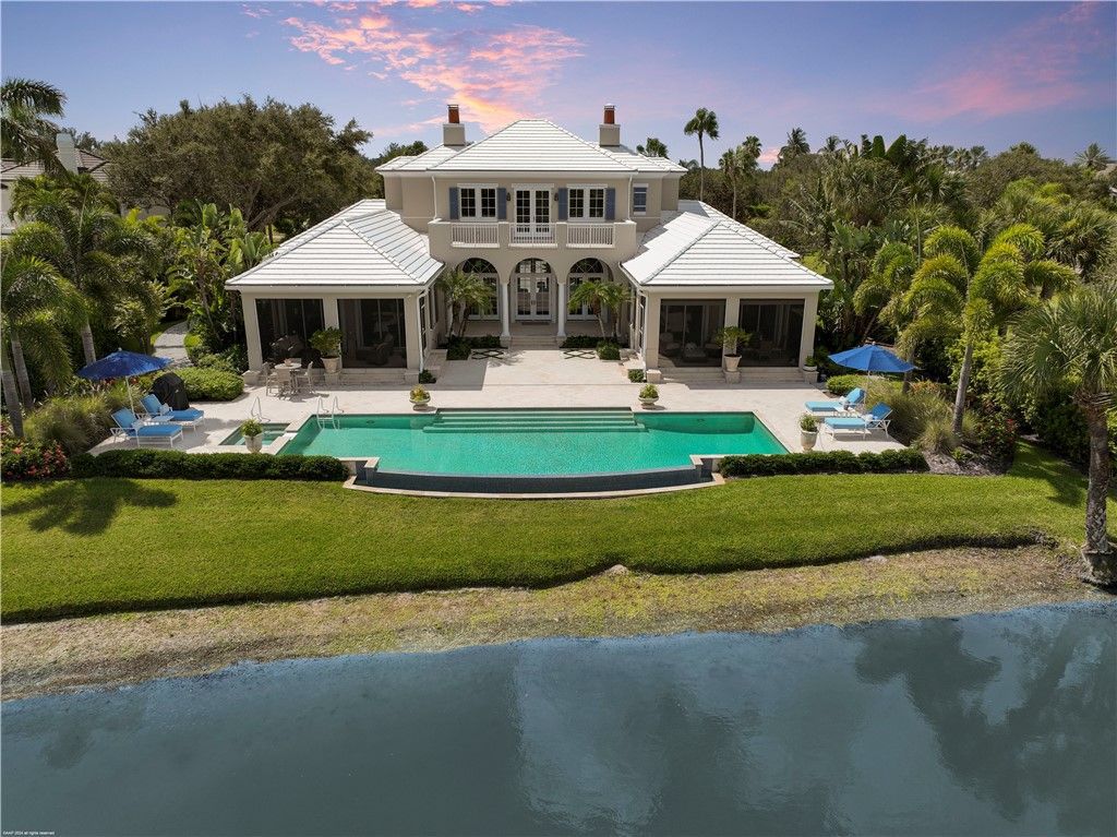 $4.7 Million Lakefront Estate in Orchid Island with Infinity Pool and Golf Course Views