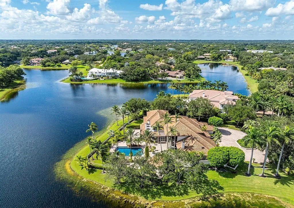 Exquisite $7.5 Million Waterfront Estate in Weston’s Prestigious Windmill Ranch Estates with Private Peninsula, and Scenic Views