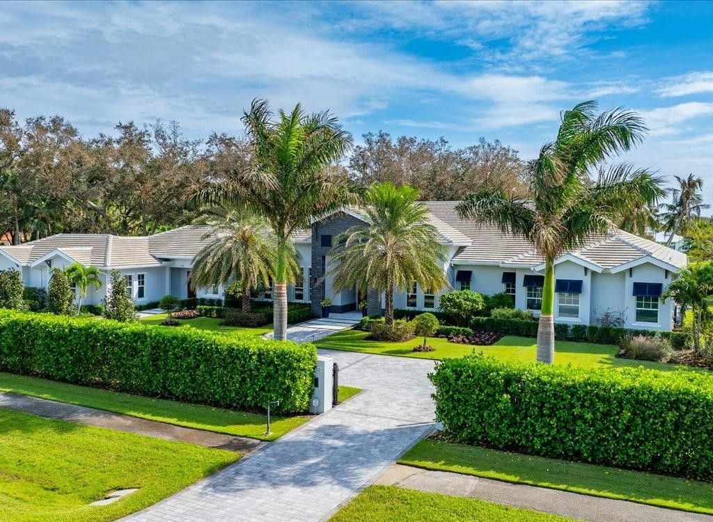 Luxurious $9 Million Coastal Modern Estate in Naples with Lakefront Lanai and Private Beach in Pine Ridge Estates