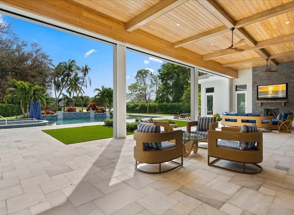 Luxurious $9 Million Coastal Modern Estate in Naples with Lakefront Lanai and Private Beach in Pine Ridge Estates