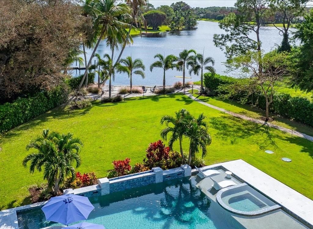 Luxurious $9 Million Coastal Modern Estate in Naples with Lakefront Lanai and Private Beach in Pine Ridge Estates