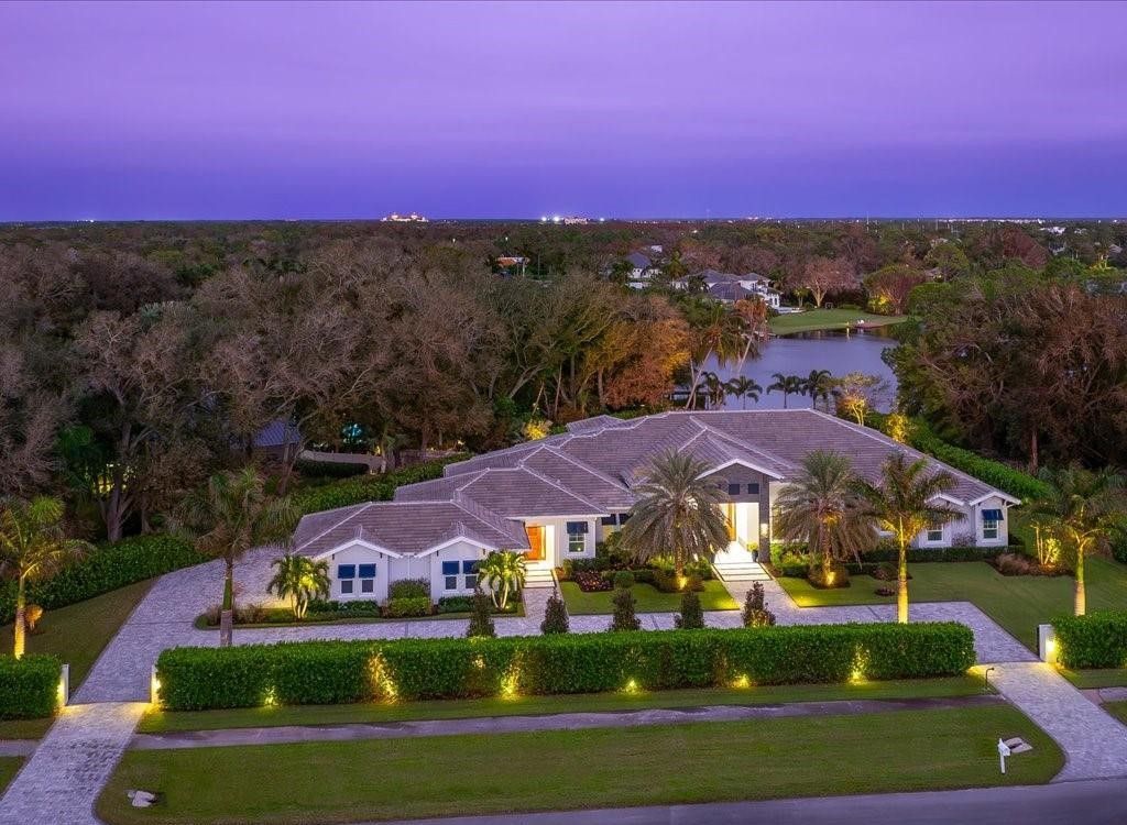 Luxurious $9 Million Coastal Modern Estate in Naples with Lakefront Lanai and Private Beach in Pine Ridge Estates