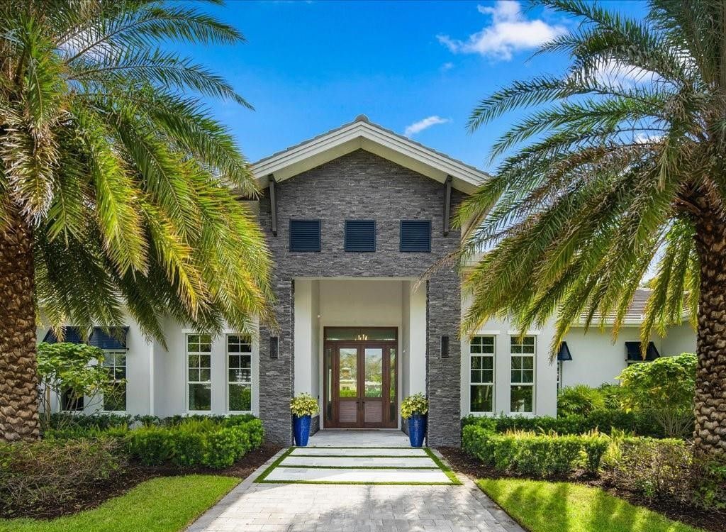 Luxurious $9 Million Coastal Modern Estate in Naples with Lakefront Lanai and Private Beach in Pine Ridge Estates