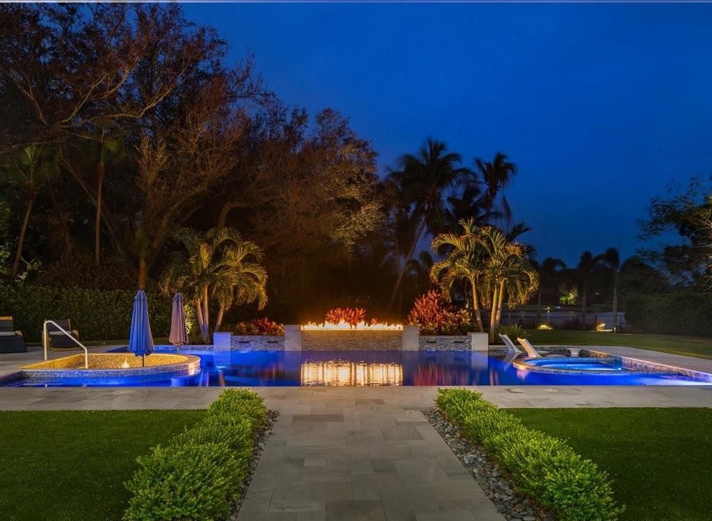 Luxurious $9 Million Coastal Modern Estate in Naples with Lakefront Lanai and Private Beach in Pine Ridge Estates