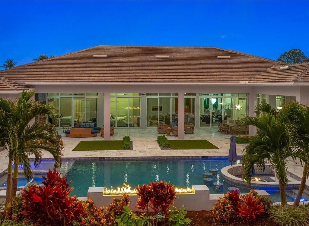 Luxurious $9 Million Coastal Modern Estate in Naples with Lakefront Lanai and Private Beach in Pine Ridge Estates