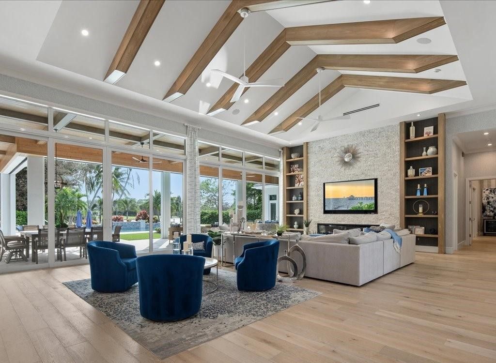 Luxurious $9 Million Coastal Modern Estate in Naples with Lakefront Lanai and Private Beach in Pine Ridge Estates