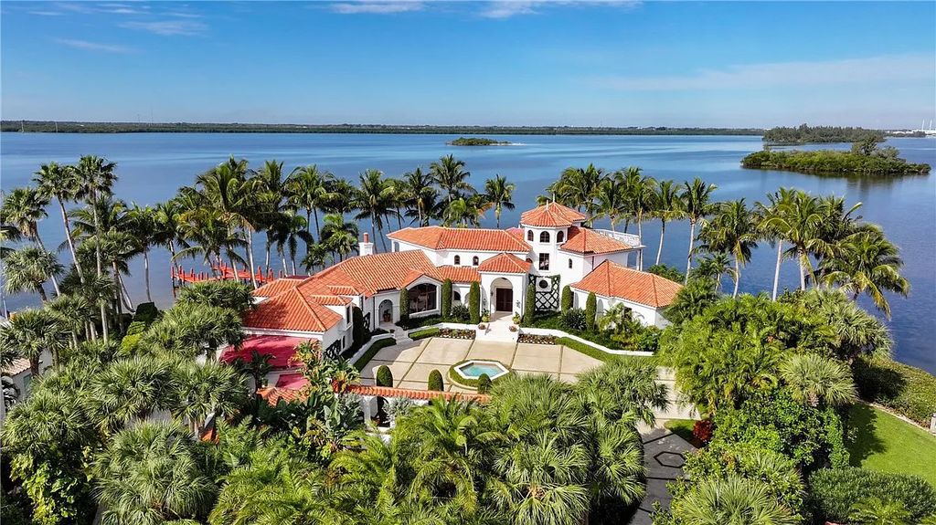 Located in the prestigious Little Harbour community, this magnificent Mizner-inspired Cote d'Azur estate offers 5 bedrooms, 7 full baths, and 2 half baths across 6,812± square feet.