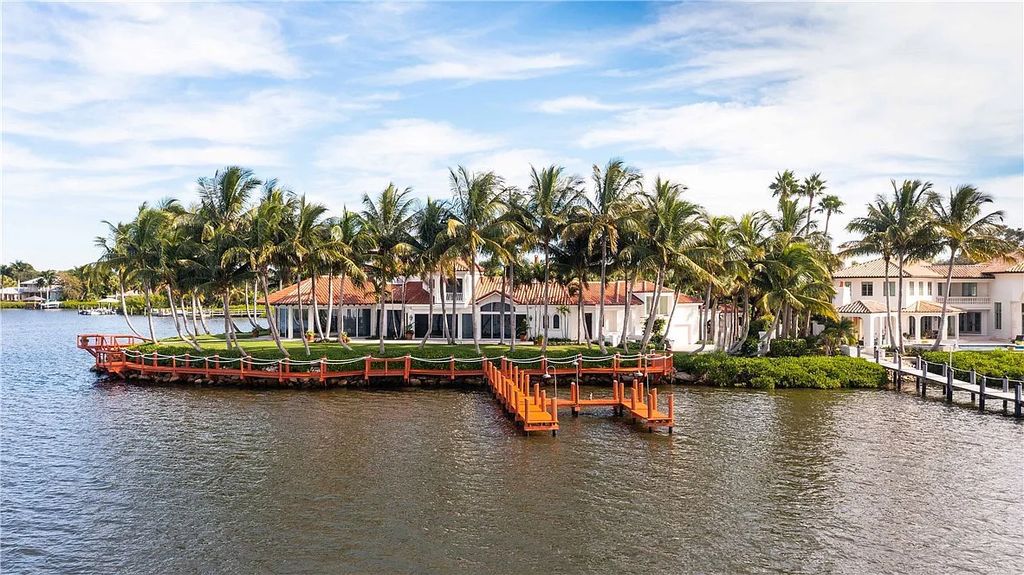 Located in the prestigious Little Harbour community, this magnificent Mizner-inspired Cote d'Azur estate offers 5 bedrooms, 7 full baths, and 2 half baths across 6,812± square feet.