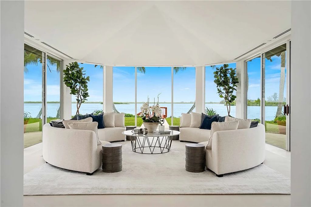 Located in the prestigious Little Harbour community, this magnificent Mizner-inspired Cote d'Azur estate offers 5 bedrooms, 7 full baths, and 2 half baths across 6,812± square feet.