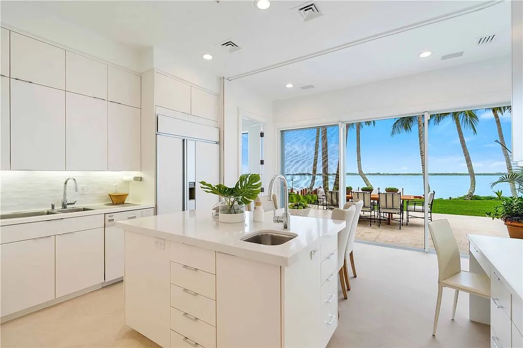 Located in the prestigious Little Harbour community, this magnificent Mizner-inspired Cote d'Azur estate offers 5 bedrooms, 7 full baths, and 2 half baths across 6,812± square feet.