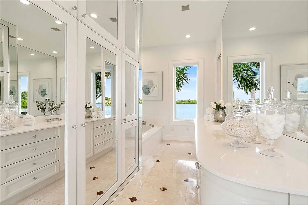 Located in the prestigious Little Harbour community, this magnificent Mizner-inspired Cote d'Azur estate offers 5 bedrooms, 7 full baths, and 2 half baths across 6,812± square feet.