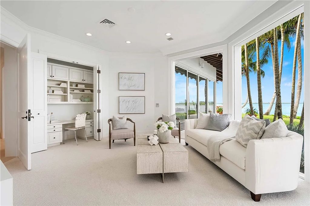 Located in the prestigious Little Harbour community, this magnificent Mizner-inspired Cote d'Azur estate offers 5 bedrooms, 7 full baths, and 2 half baths across 6,812± square feet.